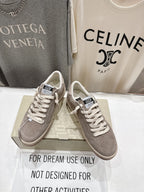 Golden Goose gray low-top sneakers, lace-up design, standing side-by-side