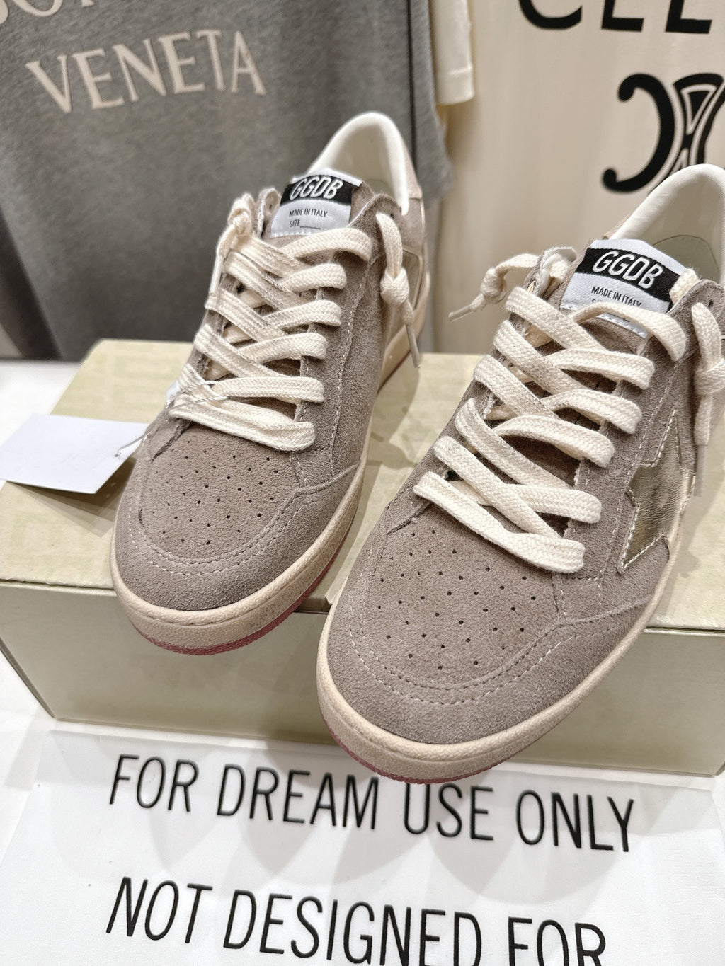 Golden Goose gray low-top sneakers, front view with perforated toe panels