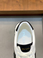White sneaker interior view with Prada branding on tongue and insole