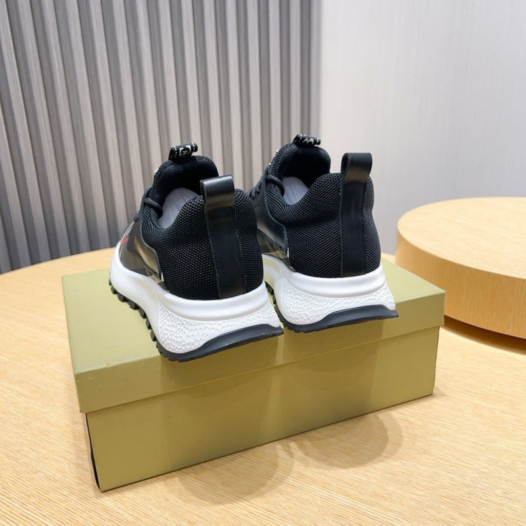 Rear view of dark sock sneakers with elastic collar and white cushioned sole