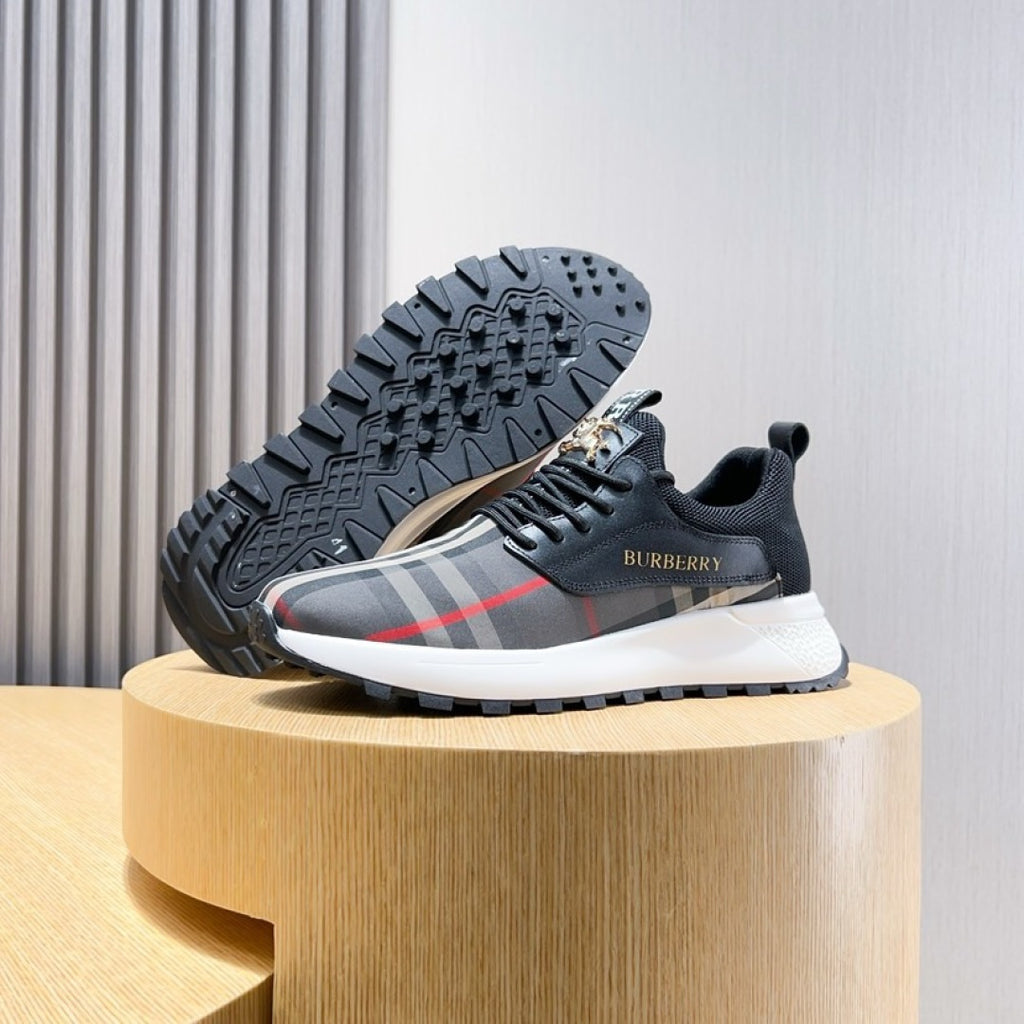 Outsole view of dark sneaker with BURBERRY check upper and white midsole
