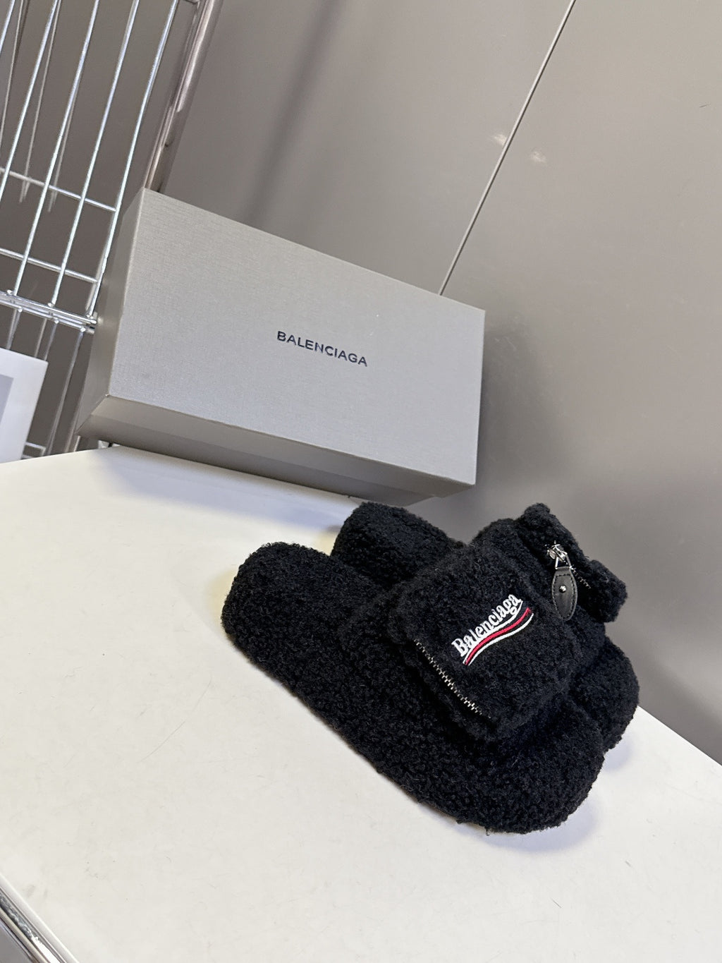 Balenciaga black fuzzy slide sandals with toe strap and logo patch