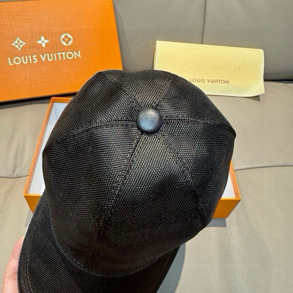 Black Louis Vuitton textured cap with rounded top button and stitched crown seams