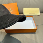 Black Louis Vuitton cap brim side view, textured fabric and stitched edge