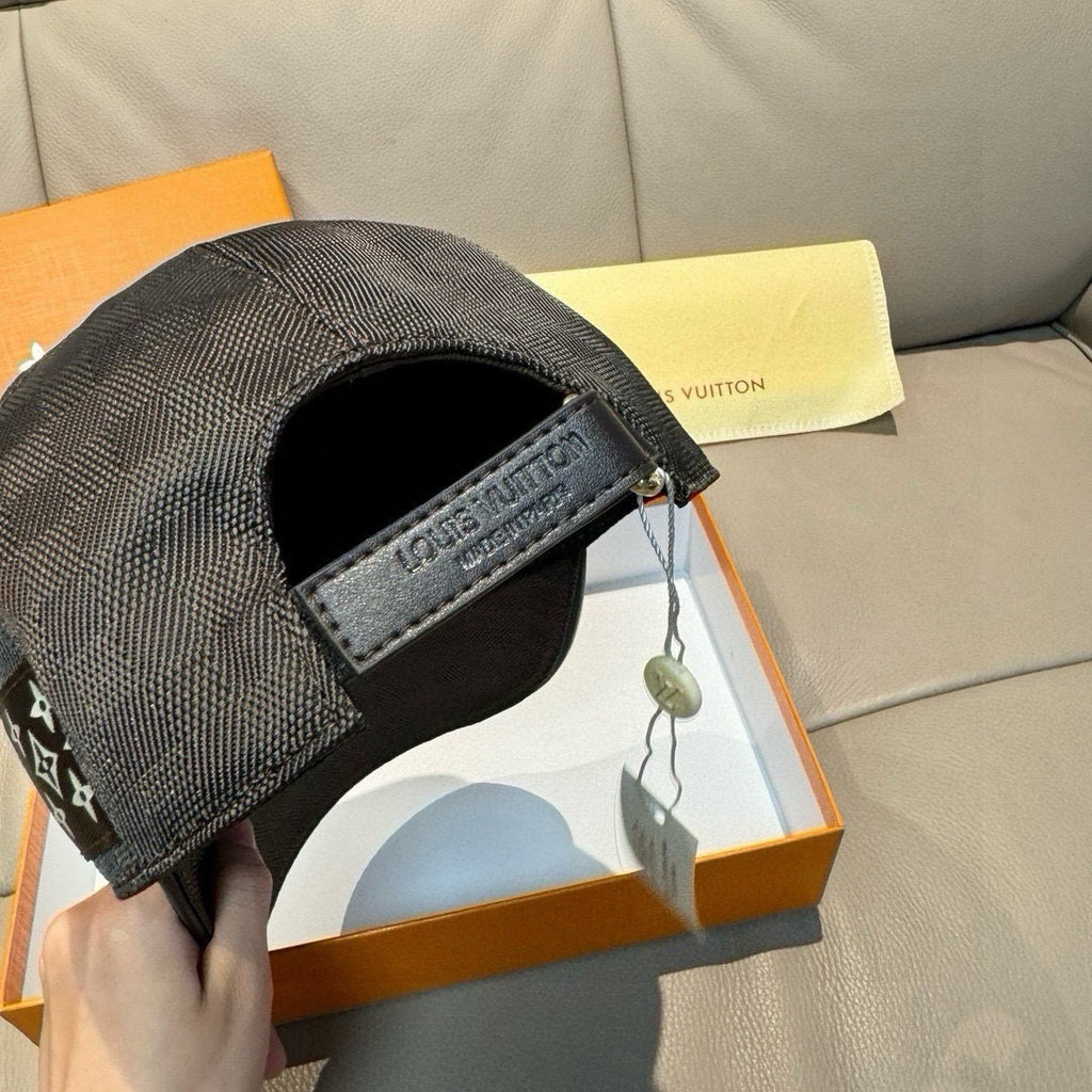 Black Louis Vuitton cap side view with interior label and adjustable strap