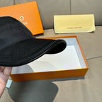 Black Louis Vuitton cap brim underside and crown edge shown from side