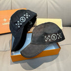 Black Louis Vuitton caps with monogram star logo patches on front and sides