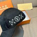 Black Louis Vuitton cap close-up with round LV monogram star badge on front