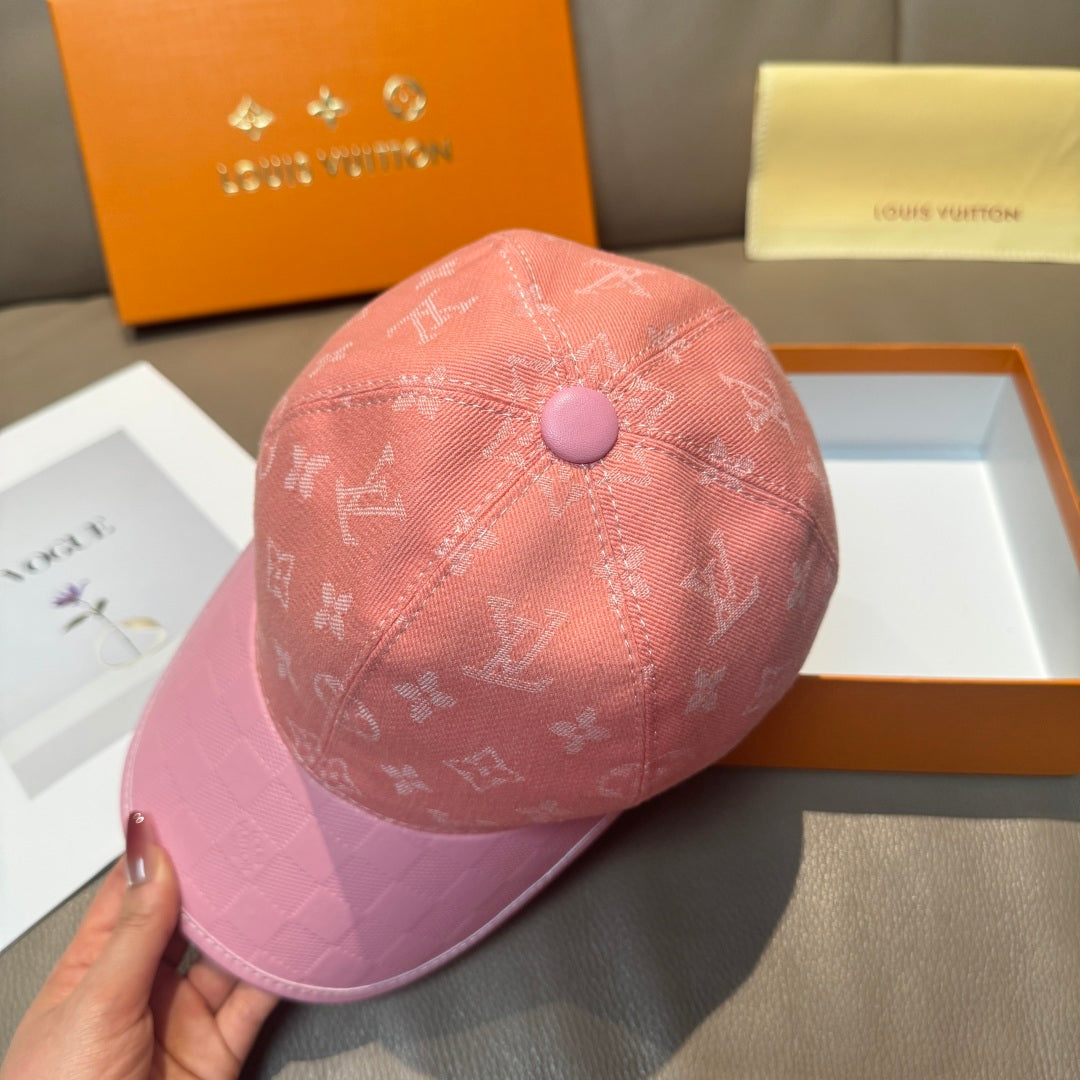 Pink monogram baseball cap, side view with purple top button