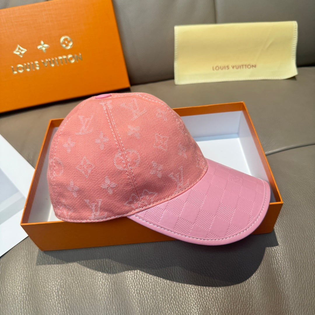 Pink monogram baseball cap with checkered brim, angled view