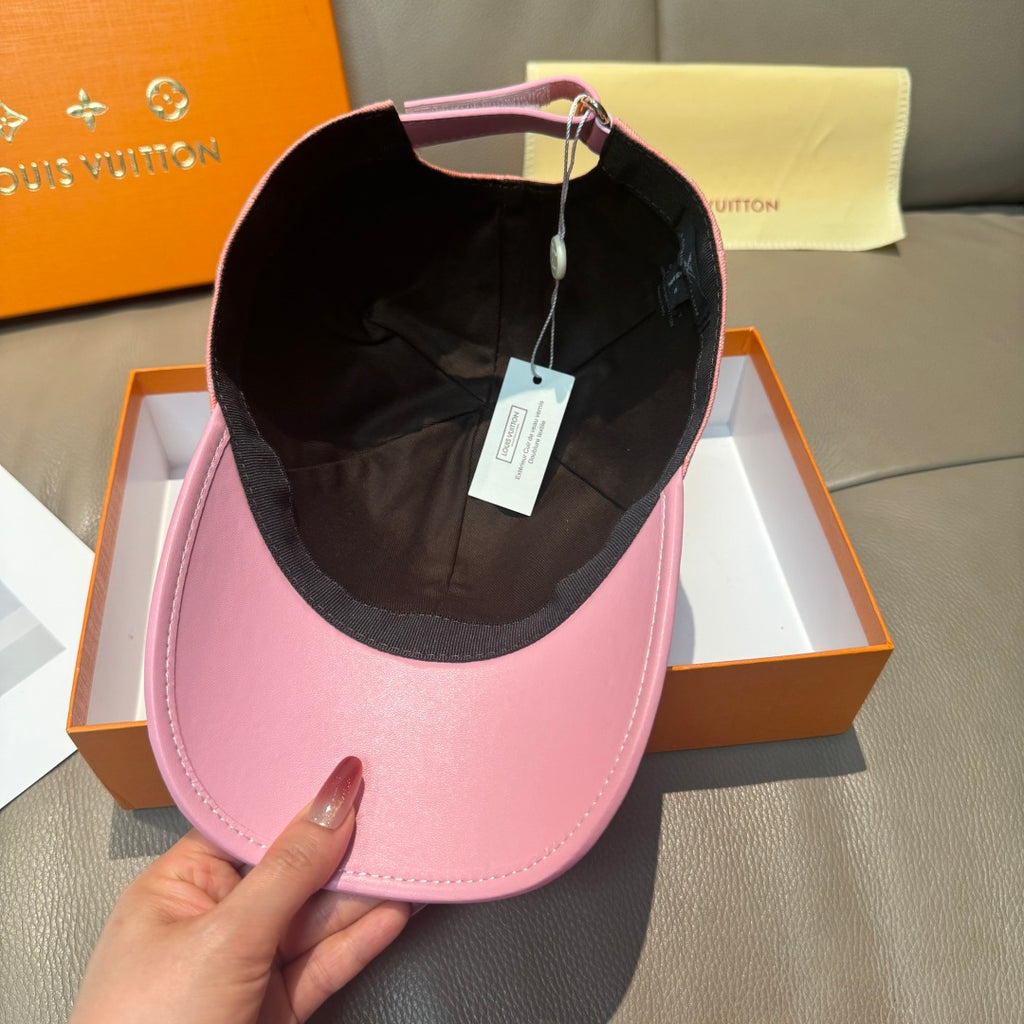 Pink baseball cap with black inner lining, worn open