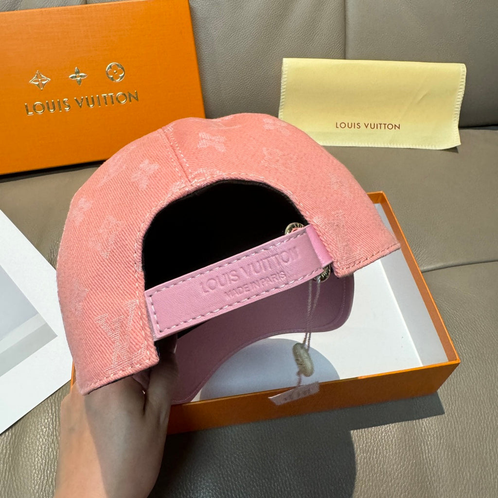 Pink cap interior with Louis Vuitton strap label and black lining