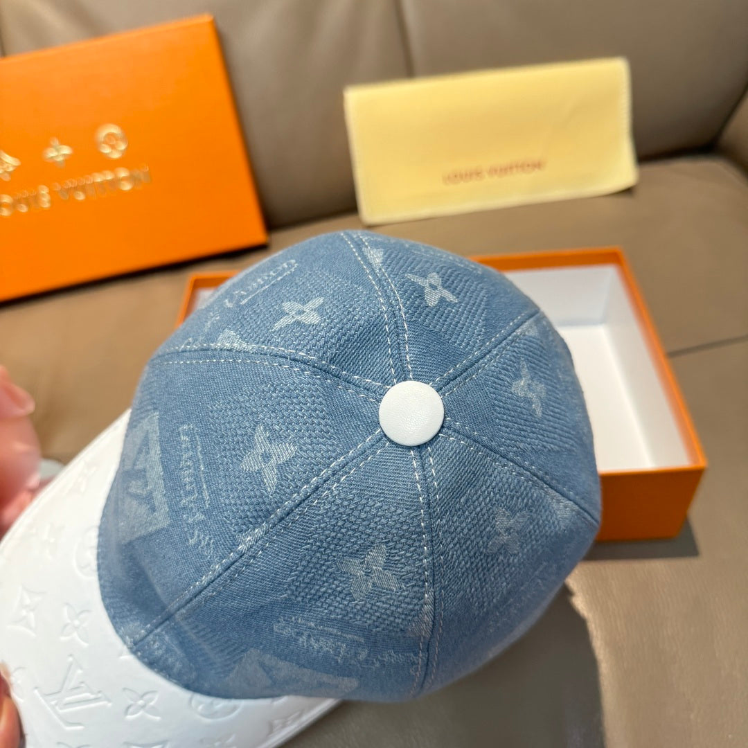 Louis Vuitton cap close-up with blue monogram fabric and round top button