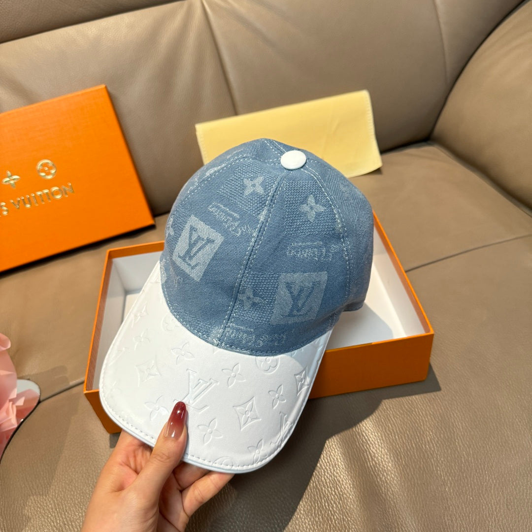 Louis Vuitton cap with blue monogram front and white brim, viewed from side