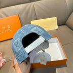 Louis Vuitton cap interior view: blue monogram shell with white inner strap