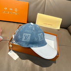 Louis Vuitton denim cap with blue top and white underside, monogram logo print