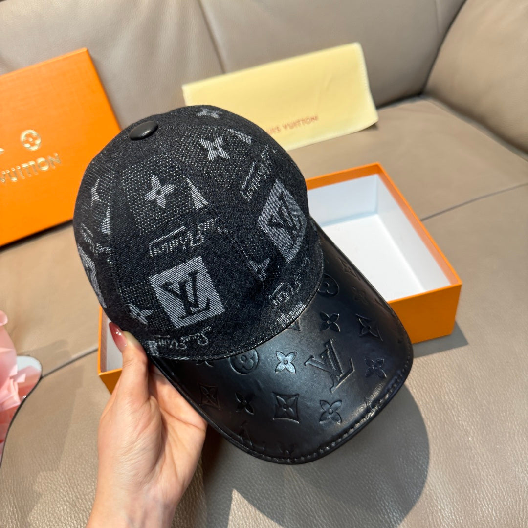 Louis Vuitton monogram baseball cap on dark fabric with black leather brim, side view
