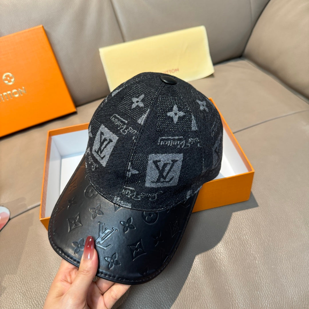 Louis Vuitton monogram baseball cap with dark fabric paneling and black leather brim