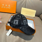 Louis Vuitton monogram baseball cap in dark with black brim and hanging product tag