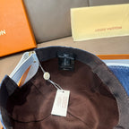 Denim monogram baseball cap interior with adjustable strap and hanging tag
