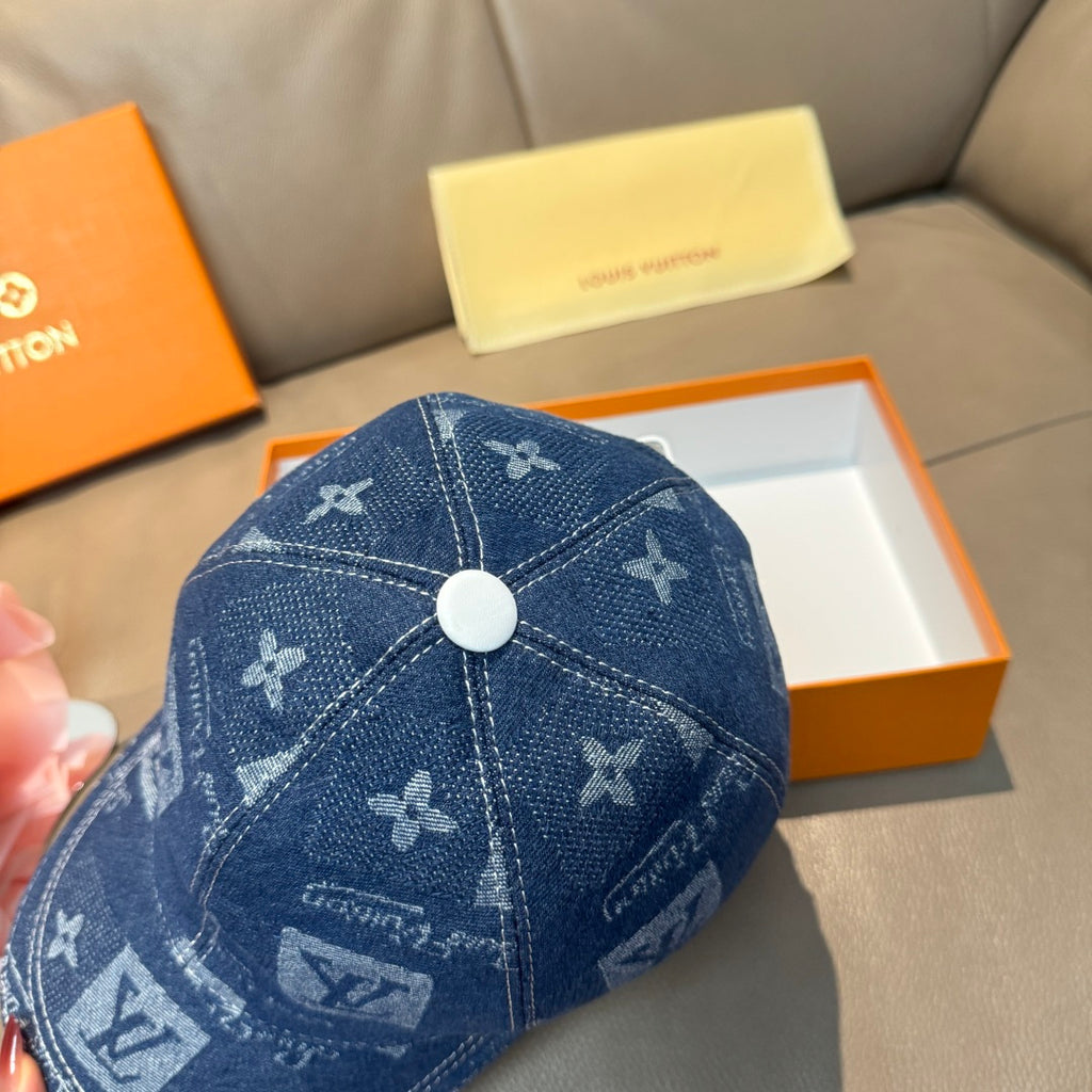 Denim blue monogram baseball cap with round top button and logo pattern