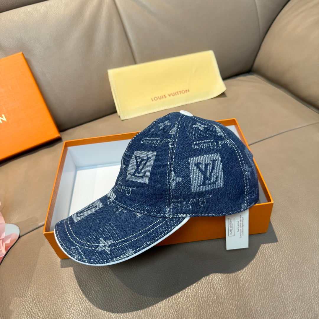 Denim blue monogram baseball cap, front view with curved brim and crown seam
