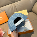 Louis Vuitton blue denim cap back opening with strap detail and hanging product tag