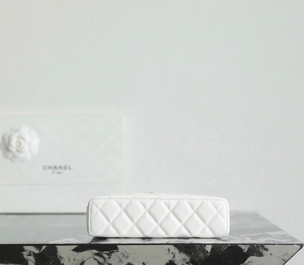 White Chanel quilted zip pouch with zipper top and small chain strap