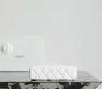 White Chanel quilted zip pouch with zipper top and small chain strap