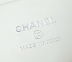 Embossed CHANEL and MADE IN ITALY mark on white leather