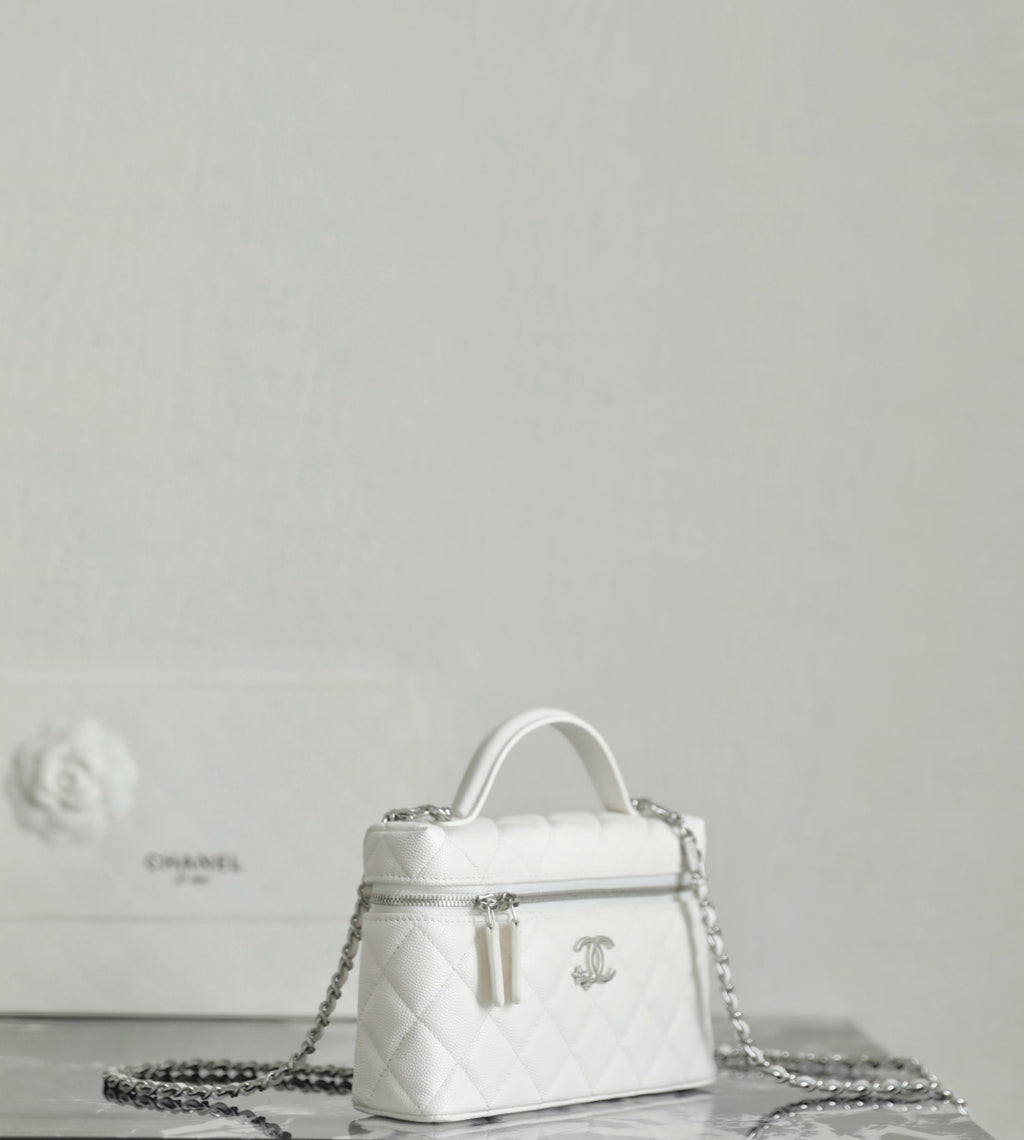 White Chanel mini bag with top handle and dangling chain strap
