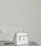 White Chanel mini bag with top handle and dangling chain strap