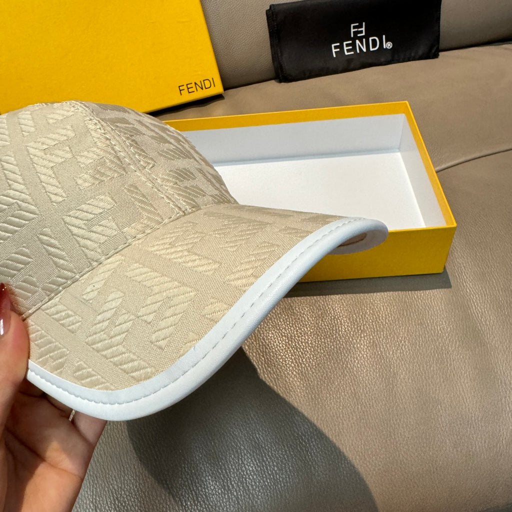 Fendi cap in light cream with logo texture and white-edged curved brim.