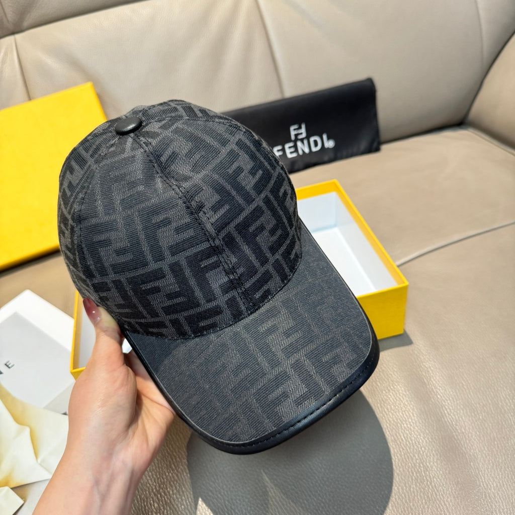 Fendi monogram baseball cap, dark gray crown with black curved brim, held side view