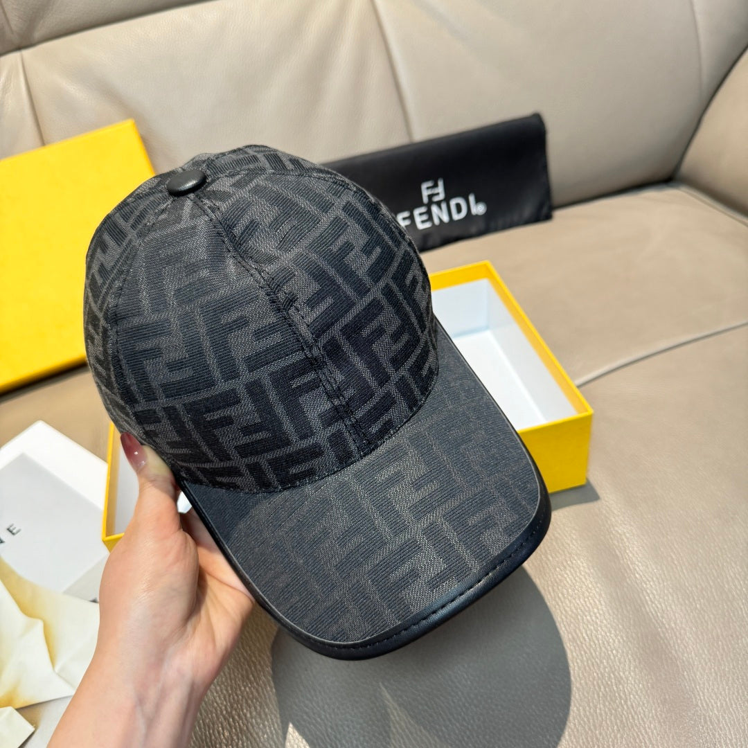 Fendi monogram baseball cap, dark gray crown with black curved brim, held side view