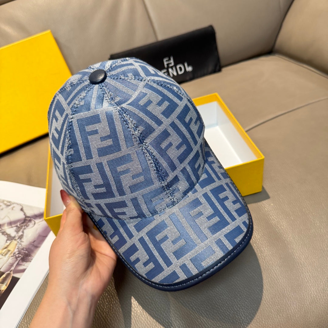 Blue FENDI monogram baseball cap held in hand, curved brim