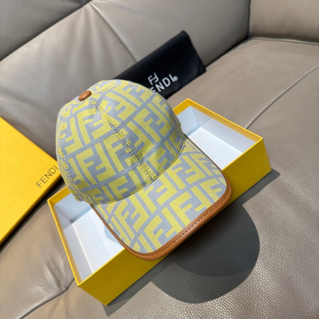 Fendi cap in light yellow with blue F-style monogram pattern and tan curved brim