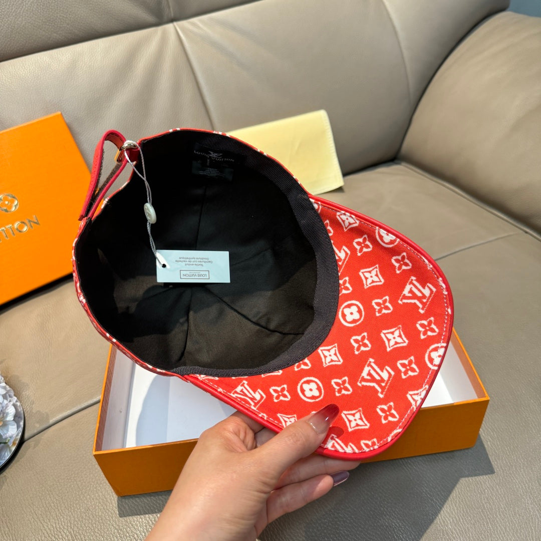 Louis Vuitton red monogram cap with black interior lining and visible inner label
