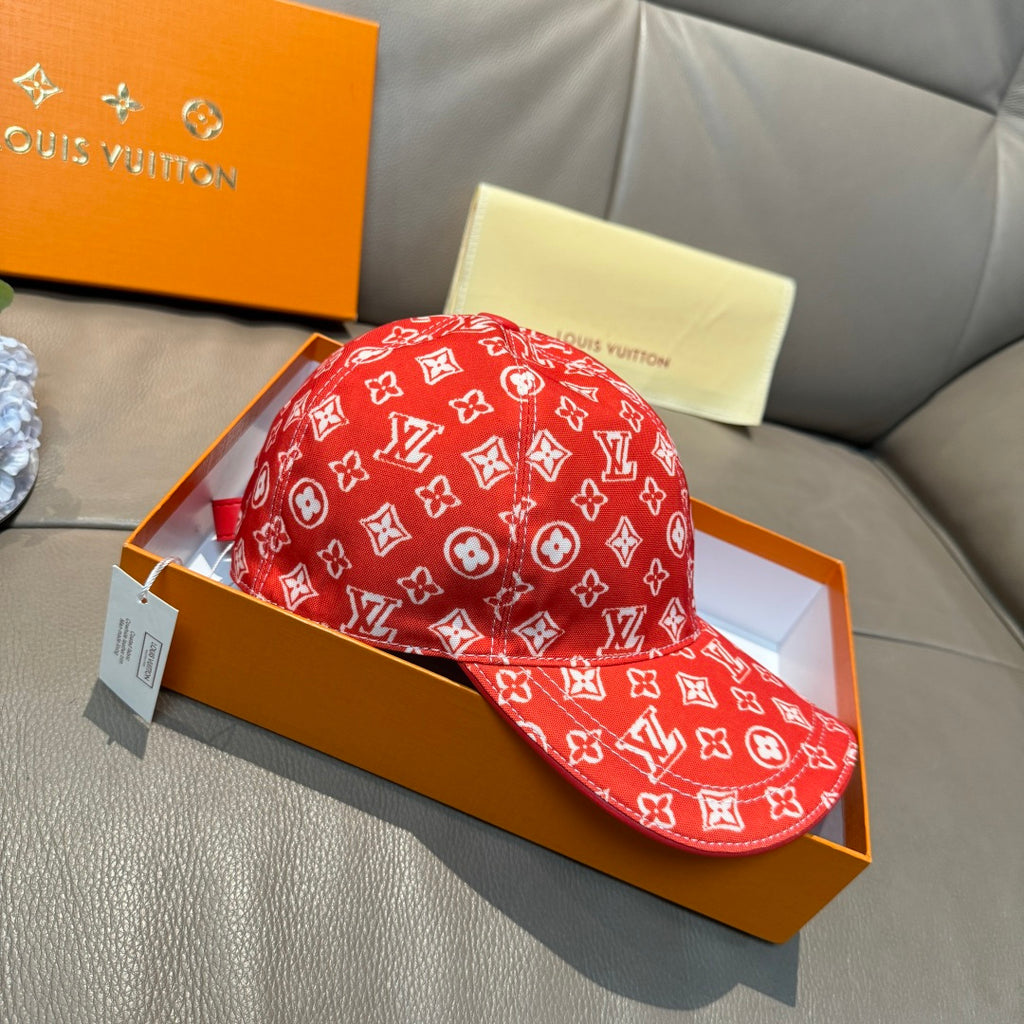 Louis Vuitton red monogram baseball cap with curved brim and hanging white tag