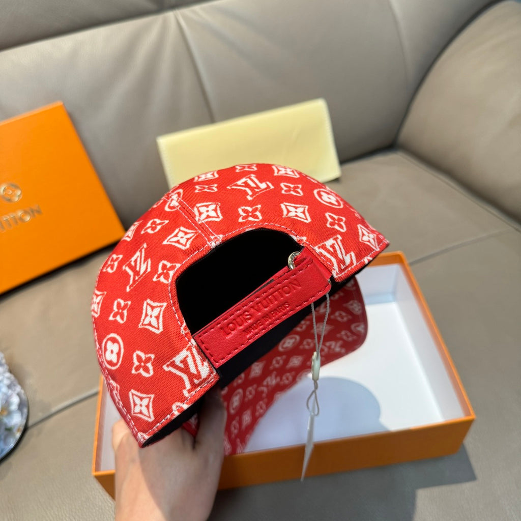Louis Vuitton red monogram cap with black band strap detail and curved brim opening