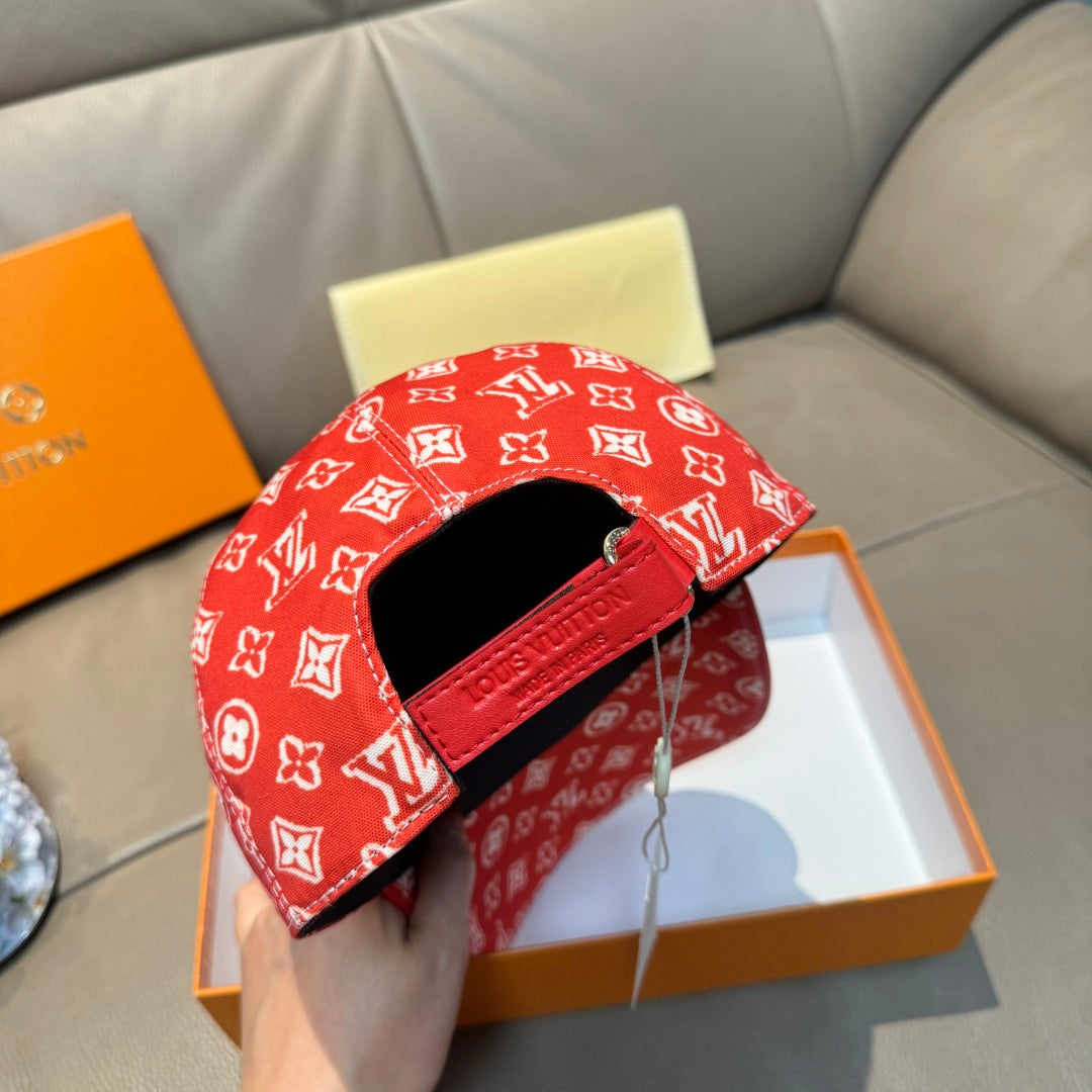 Louis Vuitton red monogram cap with black band strap detail and curved brim opening