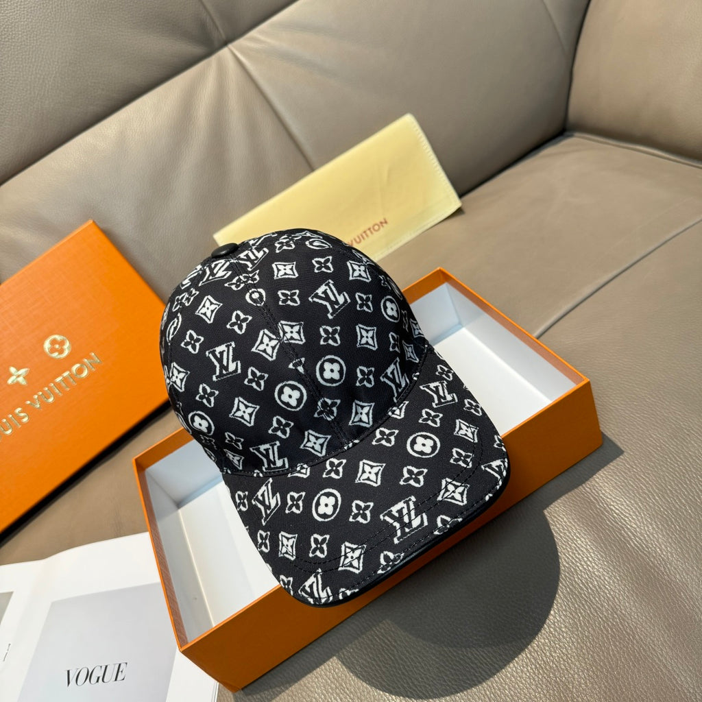 Louis Vuitton baseball cap in black with white monogram pattern, brim and crown.