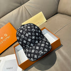 Louis Vuitton baseball cap in black with white monogram pattern, brim and crown.