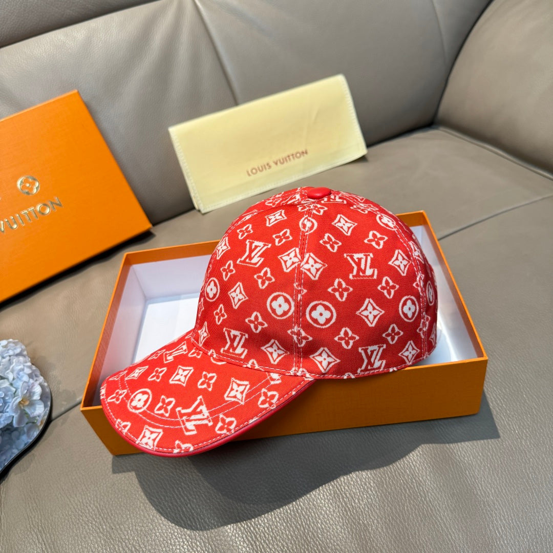 Louis Vuitton red monogram baseball cap with curved brim and stitched logo pattern