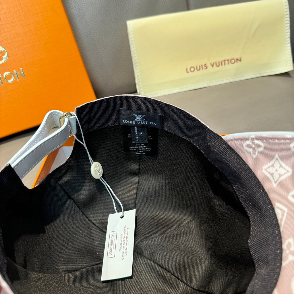 Black interior of baseball cap with Louis Vuitton label and hanging tags