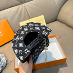 Louis Vuitton cap inner strap and label, black with white monogram lining.
