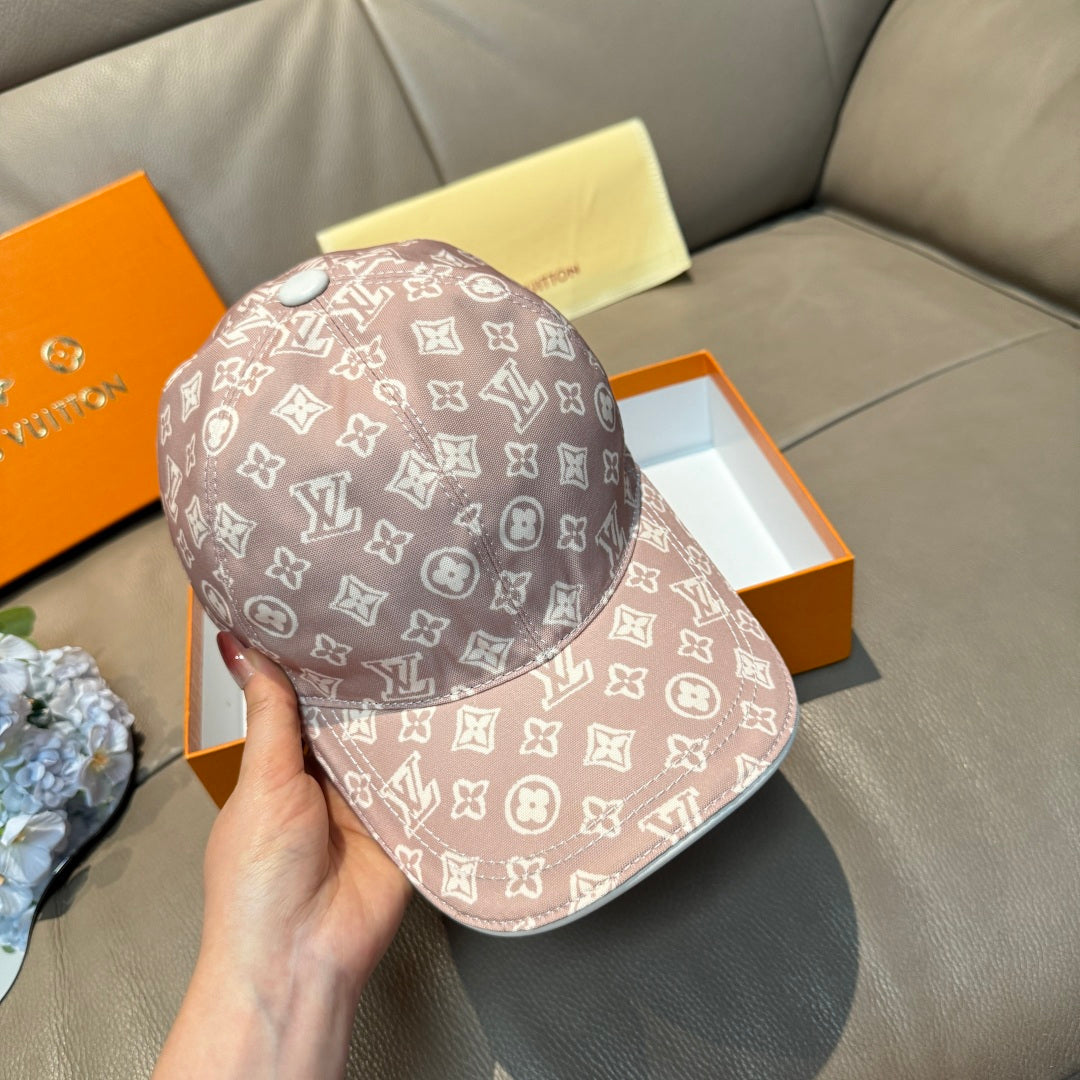 Taupe monogram baseball cap with white logos, curved brim; front-left view