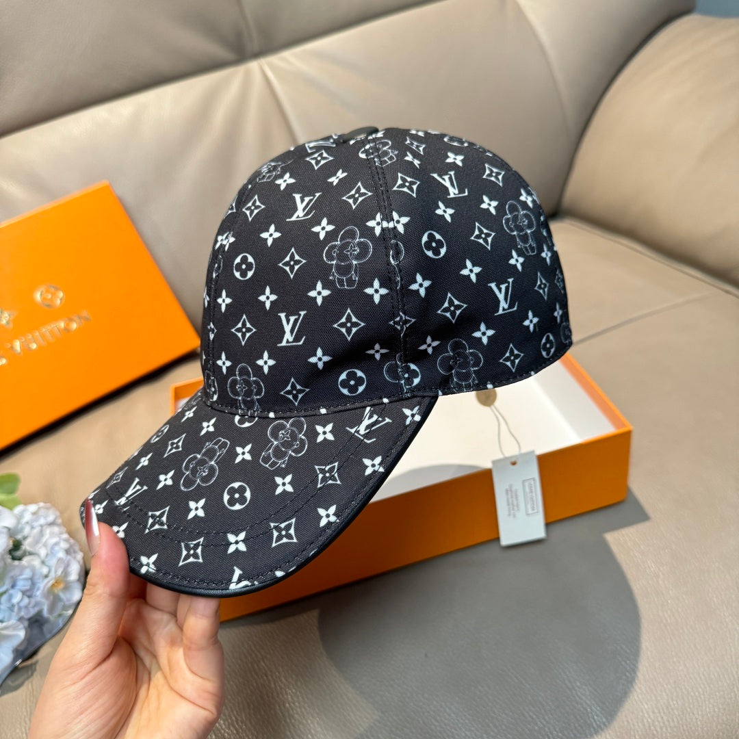 Black baseball cap with white monogram pattern, hand-held front view