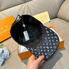 Black baseball cap interior and brim underside with adjustable strap and hanging tag