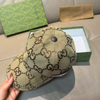 Gucci monogram baseball cap in beige with small top button and logo pattern.